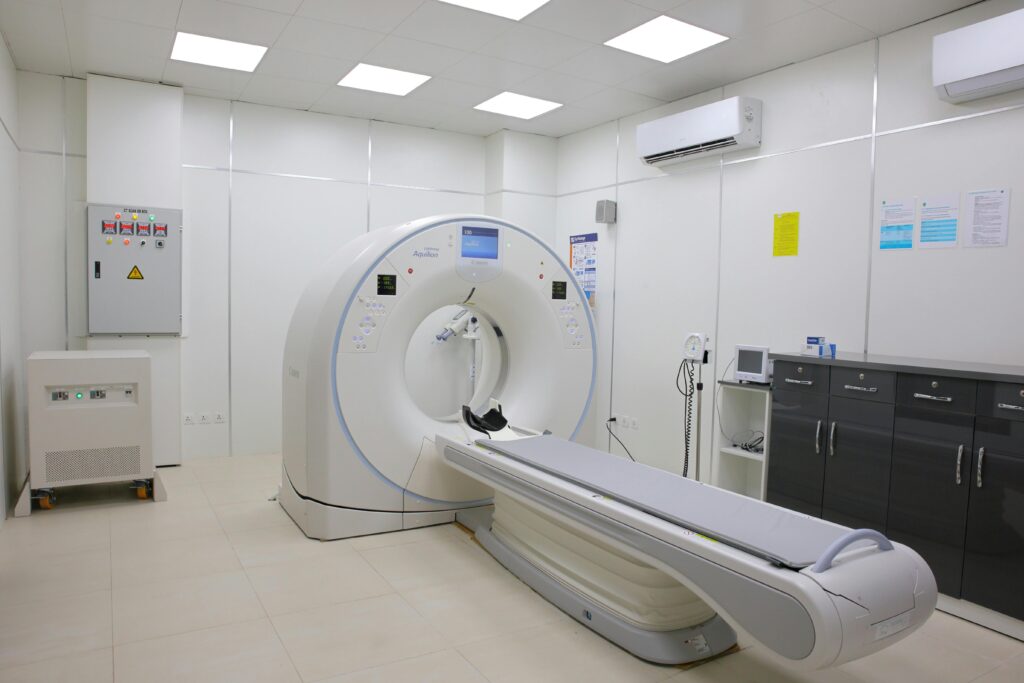 Bright and sterile hospital imaging room featuring a state-of-the-art CT scanner.